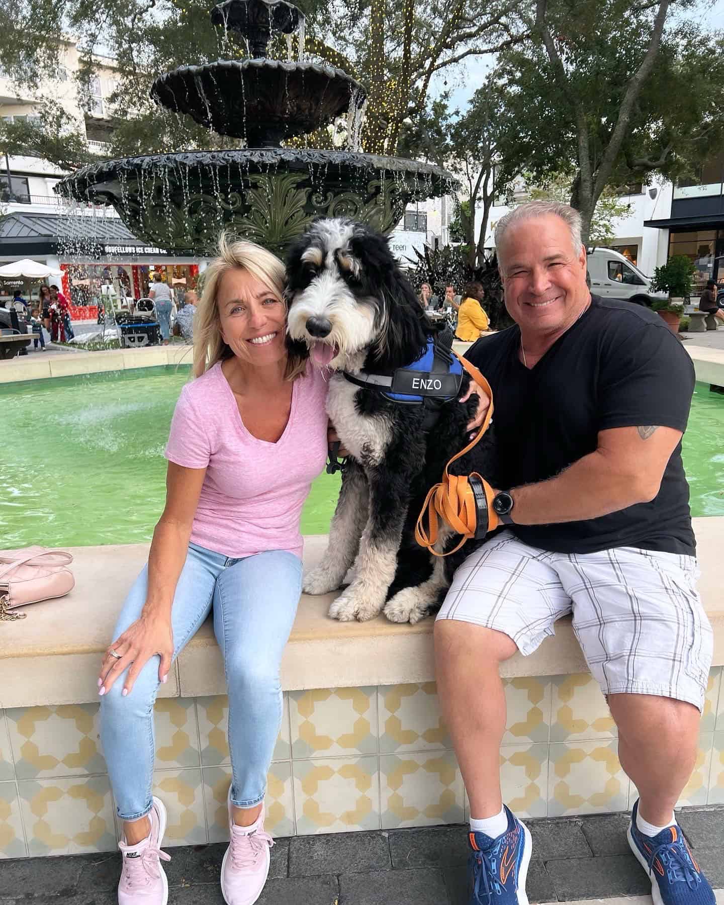 A happy couple with their dog after purchasing dog training in St. Augustine, FL