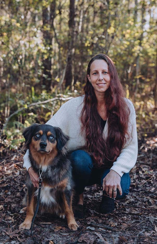Erika, expert dog trainer in St. Augustine, FL, with his dog.
