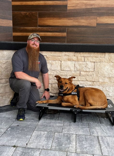 James, expert dog trainer in St. Augustine, FL, with his dog.