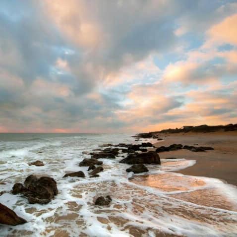 A beautiful beach with boulders, ideal for dog training in Crescent Beach, FL.